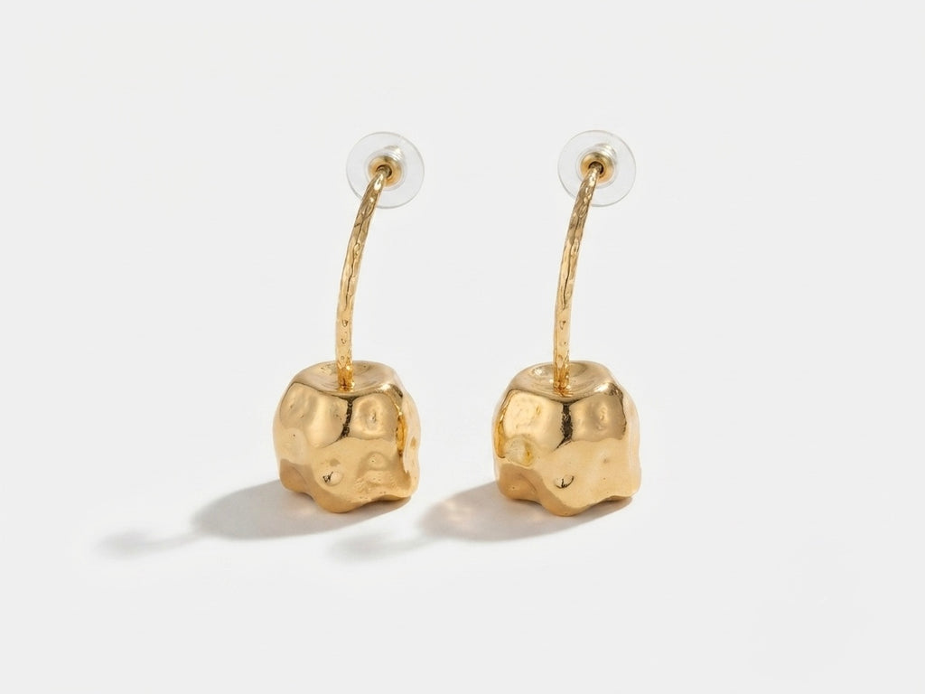 Cherry Drop Earrings — gold hoop arc with molten dimpled nugget charm, shown as a pair on white background