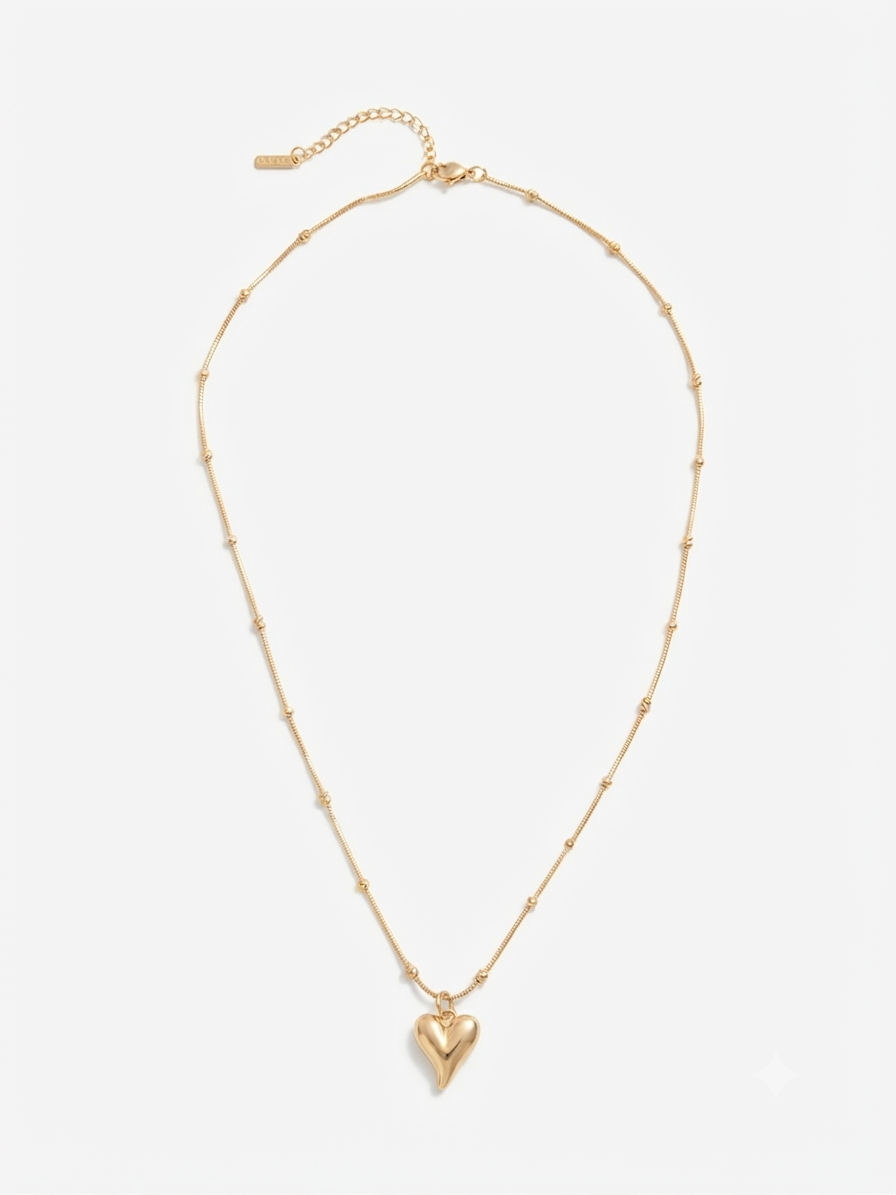 Gold puff heart pendant necklace on satellite chain