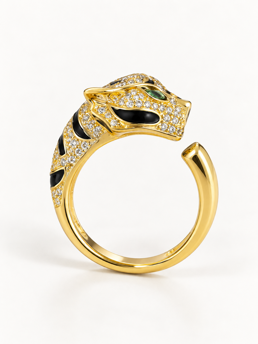 Gold-tone panther statement ring with black detailing, front view