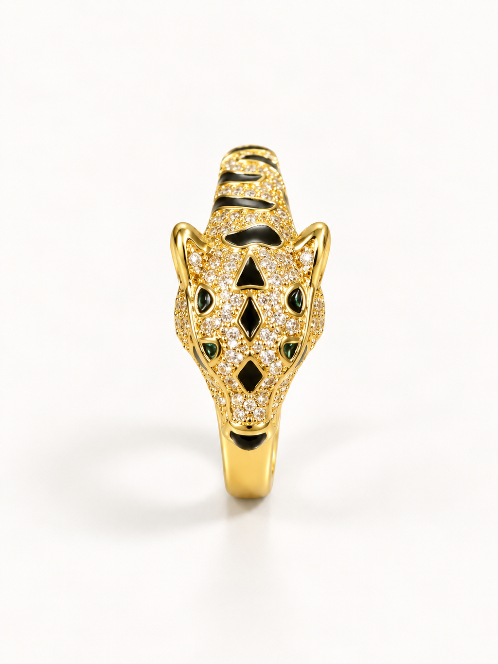 Gold-tone panther statement ring with black detailing, angled view
