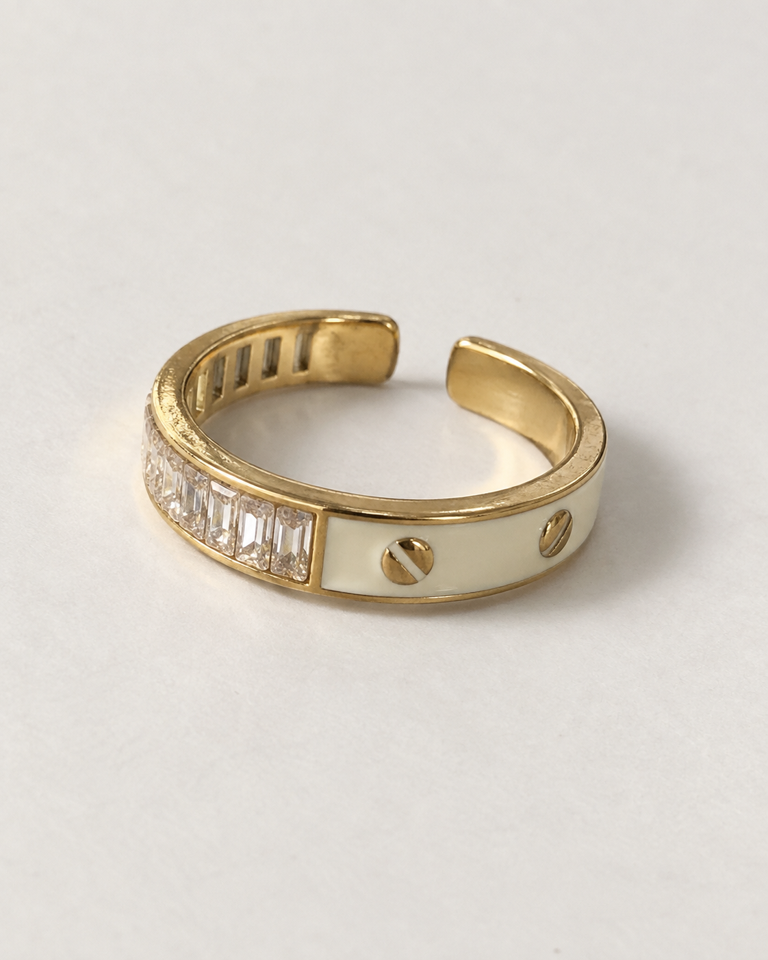 Gold-tone open ring showing crystal-style and rivet sides together