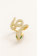 Gold-tone coiled serpent statement ring with pavé-style detailing and green eye accents