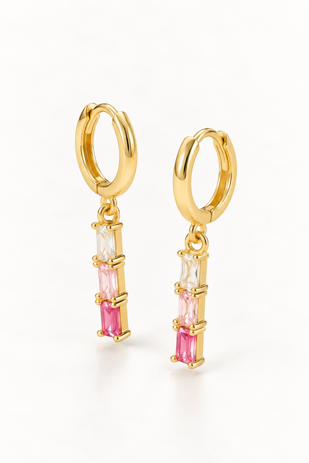 Gold-tone hoop earrings with clear and graduated pink rectangular drops